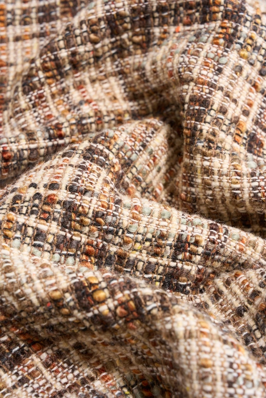 Bouclé jasje met knopen