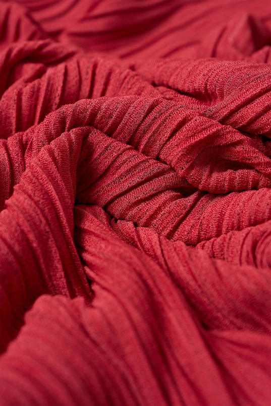 Soepelvallende plissé jurk