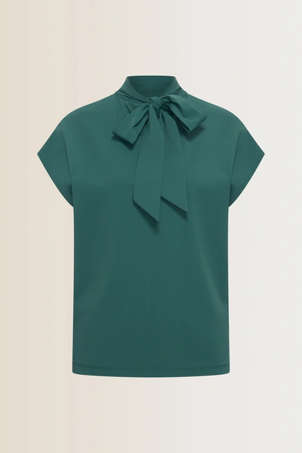 Travel top met strikdetail