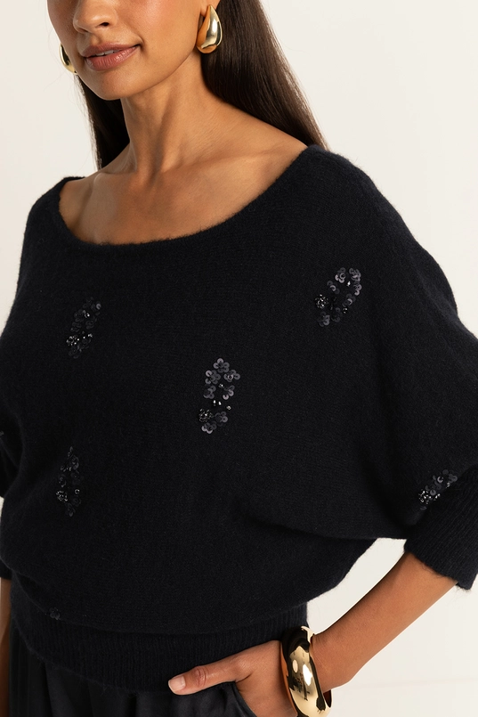 Trui met geborduurde details