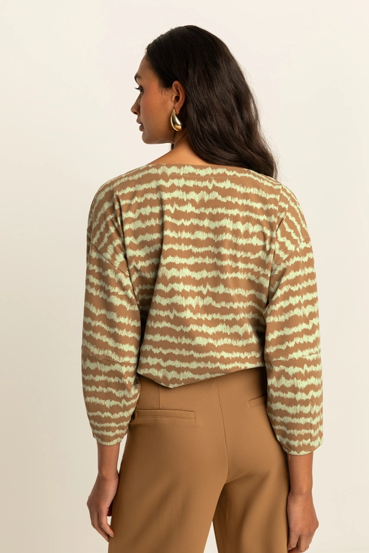 Volumineuze traveltop